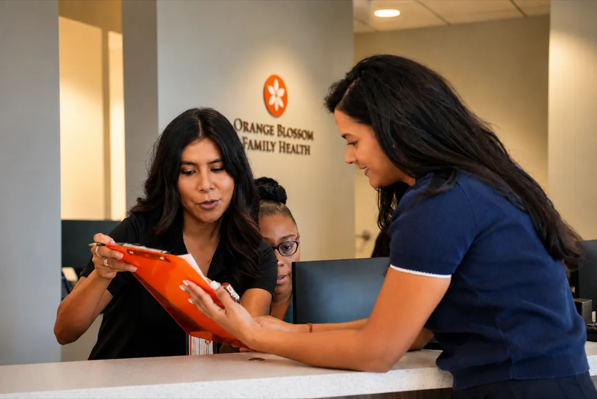 Front-desk check-in at Orange Blossom Family Health